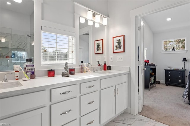 full bath featuring marble finish floor, an enclosed shower, a sink, and a healthy amount of sunlight