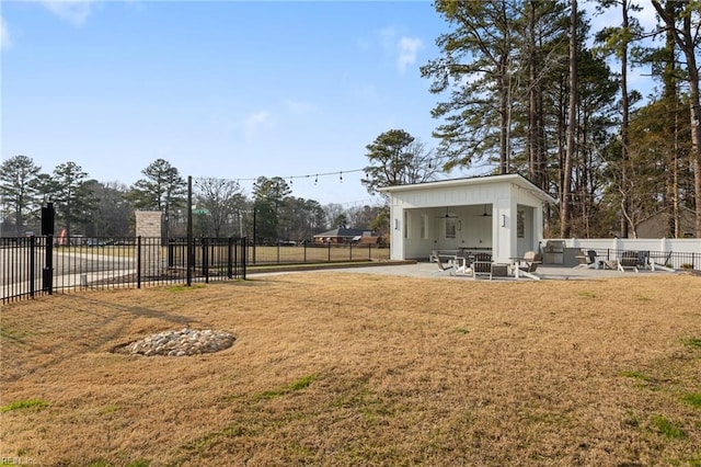 view of yard featuring ceiling fan, a patio, and fence