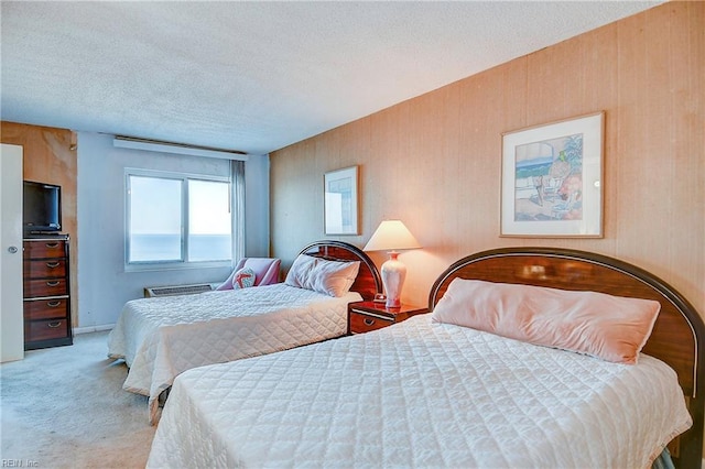 bedroom featuring carpet and a textured ceiling