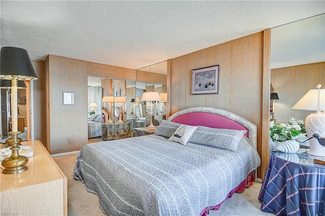 bedroom featuring carpet floors, a closet, and a textured ceiling