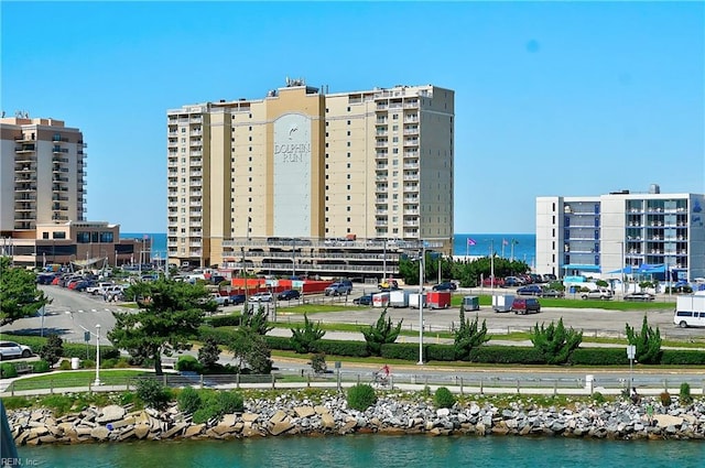 birds eye view of property with a view of city and a water view