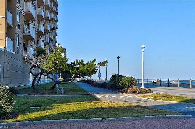 view of property's community with a lawn