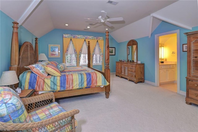 carpeted bedroom with visible vents, baseboards, ensuite bathroom, and lofted ceiling