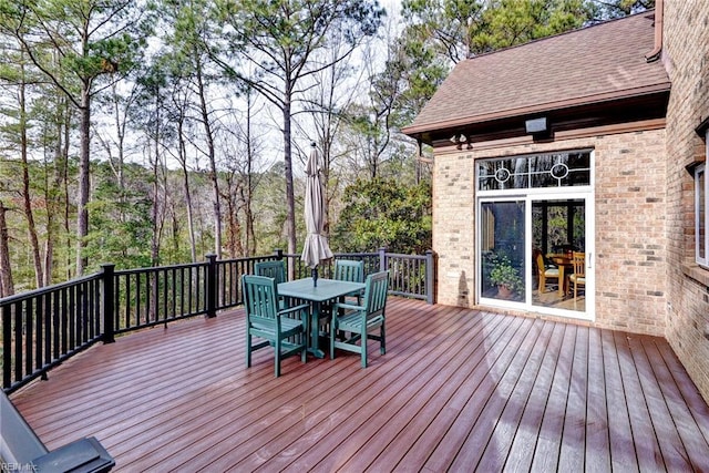 wooden deck with outdoor dining space