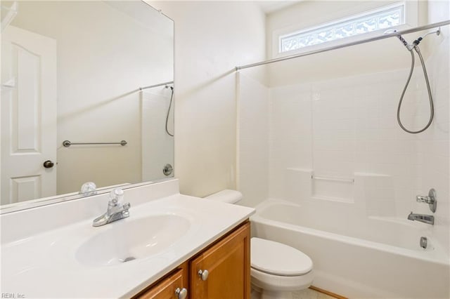 bathroom with toilet, tub / shower combination, and vanity