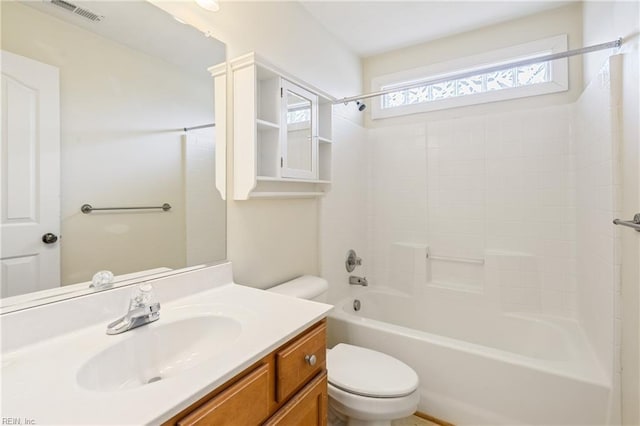 full bath with visible vents, bathing tub / shower combination, toilet, and vanity