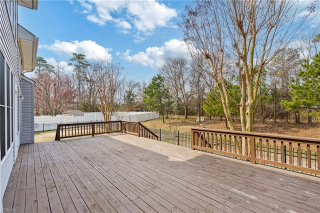 wooden deck featuring fence