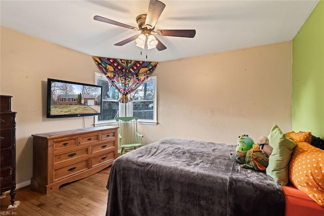 bedroom with wood-type flooring and ceiling fan