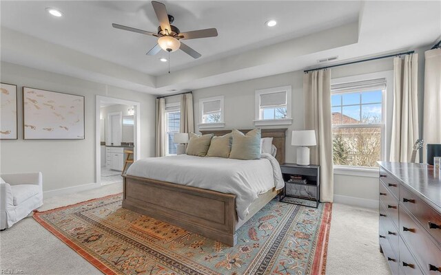 bedroom with visible vents, recessed lighting, light colored carpet, and baseboards