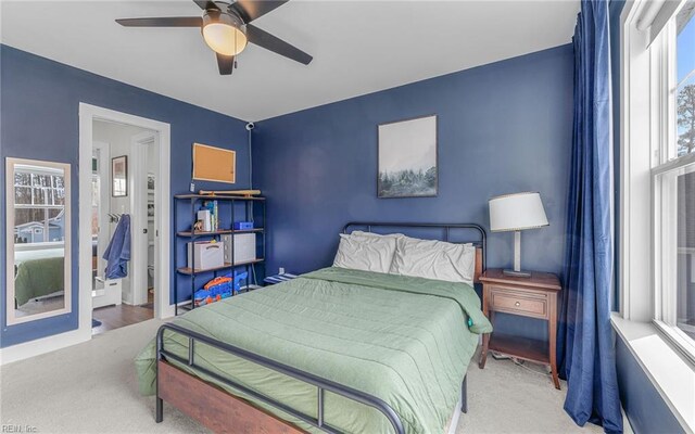 carpeted bedroom with a ceiling fan