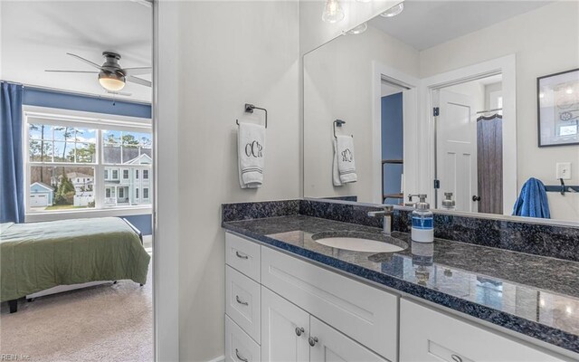 full bath featuring vanity, a ceiling fan, and ensuite bathroom