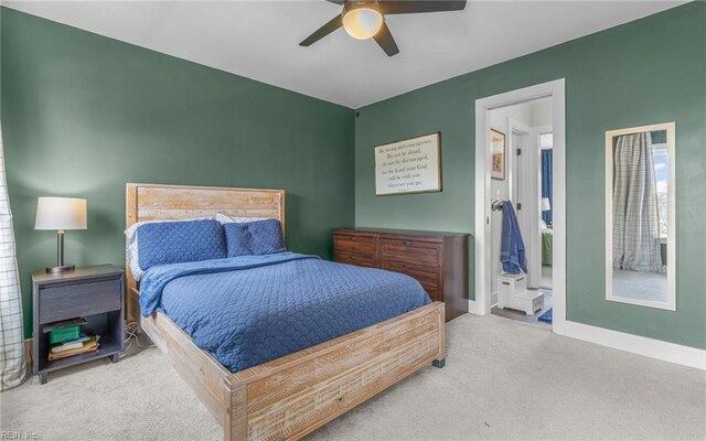 carpeted bedroom featuring a ceiling fan and baseboards