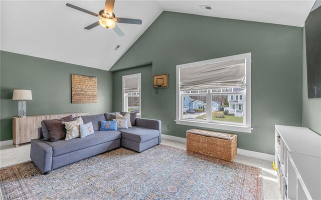 carpeted living room featuring visible vents, baseboards, ceiling fan, and high vaulted ceiling