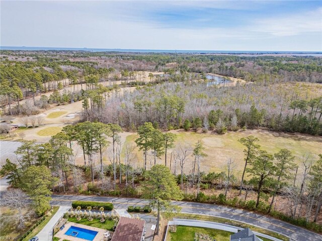 aerial view with a water view and a wooded view