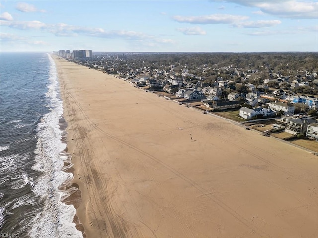 drone / aerial view featuring a view of the beach and a water view