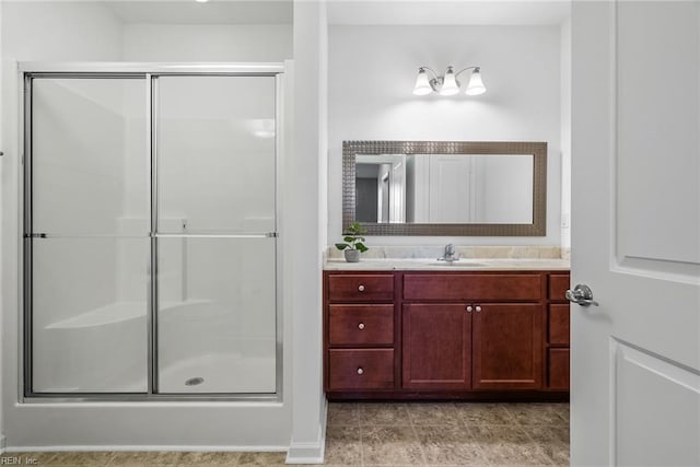 bathroom featuring a stall shower and vanity