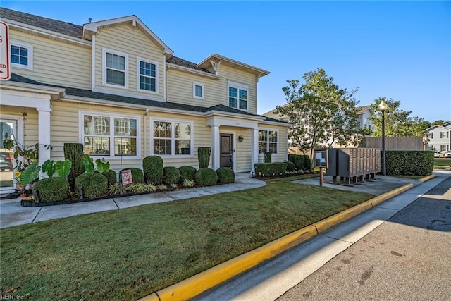 view of front of home featuring a front yard