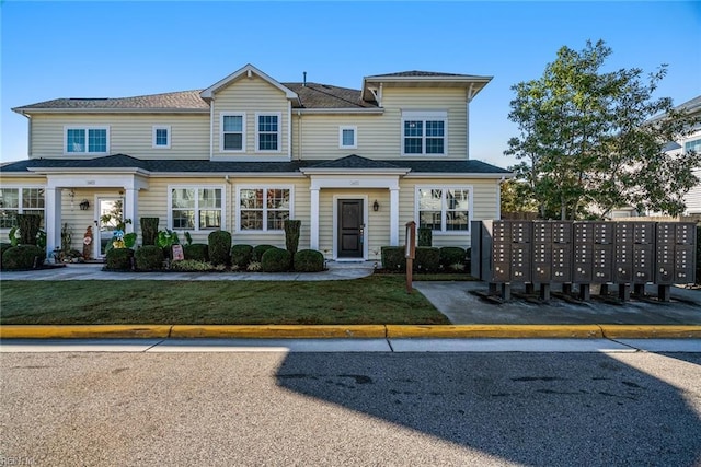 view of front facade with a front yard