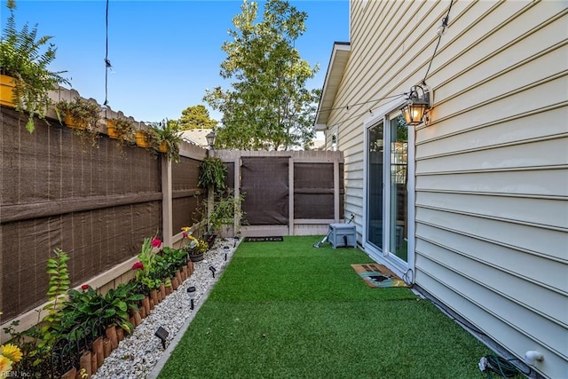 view of yard with a fenced backyard