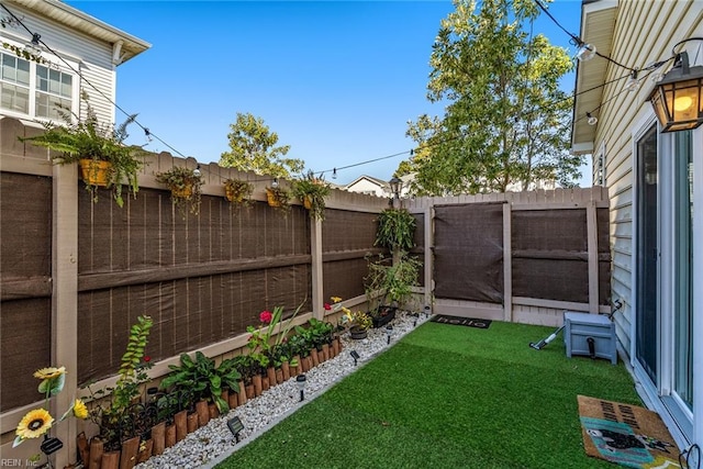 view of yard with a fenced backyard