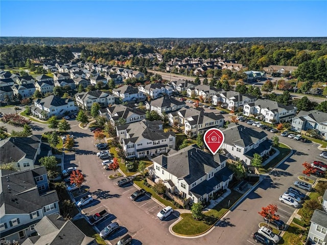 birds eye view of property with a residential view