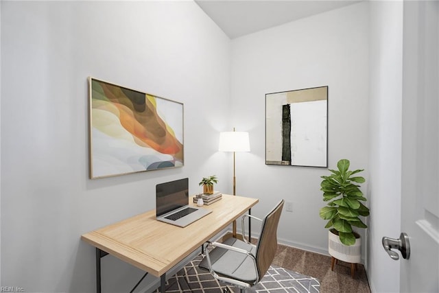 office area featuring baseboards and carpet flooring