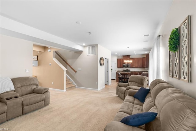 living area featuring light carpet, baseboards, visible vents, stairway, and recessed lighting