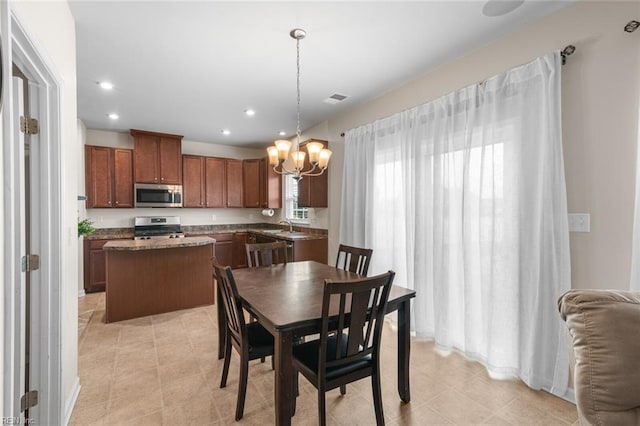 dining room with light tile patterned flooring, visible vents, and recessed lighting