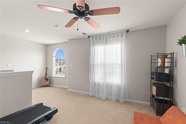 exercise area with carpet floors, visible vents, and baseboards