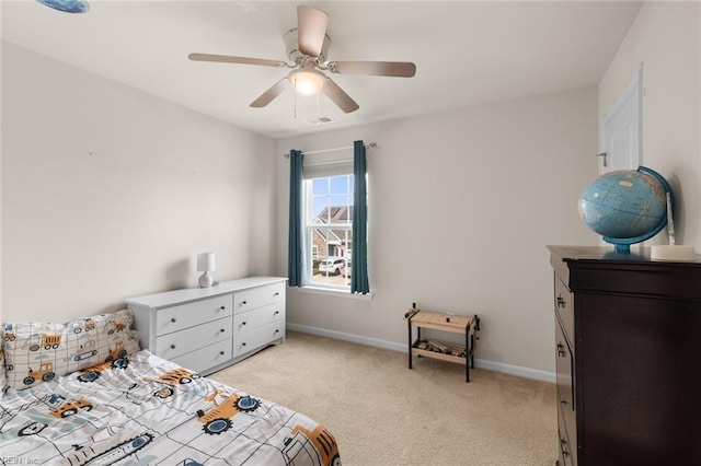 bedroom with a ceiling fan, light carpet, visible vents, and baseboards