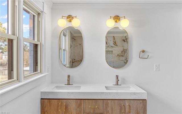 full bathroom featuring double vanity, a sink, and crown molding