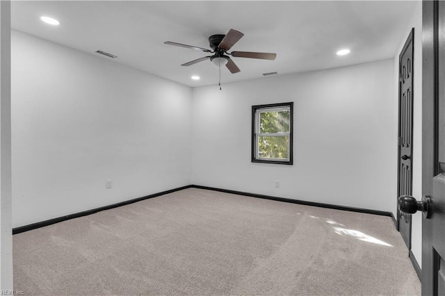 carpeted spare room featuring visible vents, baseboards, a ceiling fan, and recessed lighting