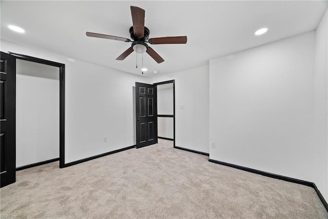 unfurnished bedroom featuring a ceiling fan, carpet, baseboards, and recessed lighting