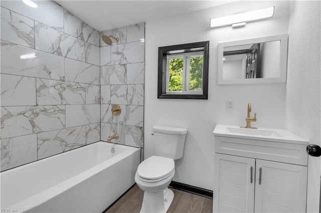 full bathroom with bathtub / shower combination, toilet, wood finished floors, vanity, and baseboards