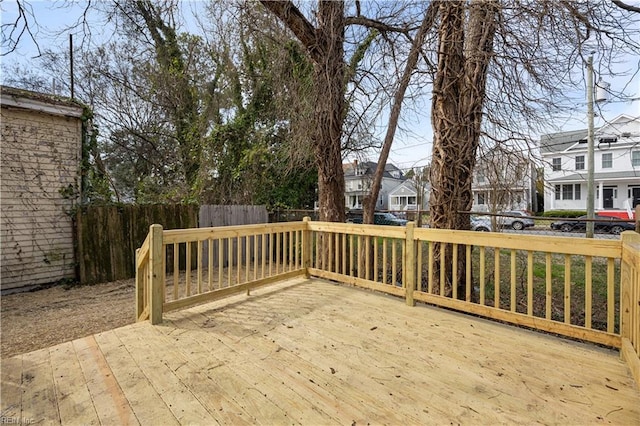 wooden terrace with fence private yard and a residential view