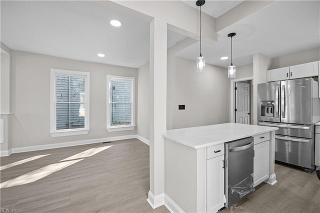 kitchen with baseboards, white cabinets, light countertops, light wood-type flooring, and stainless steel fridge with ice dispenser