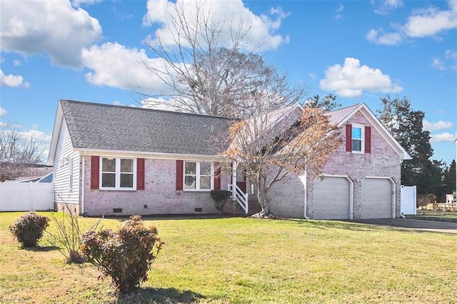 view of front facade with brick siding, fence, driveway, crawl space, and a front yard