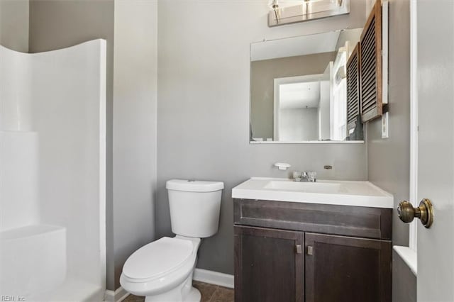 full bathroom with baseboards, a shower, toilet, tile patterned floors, and vanity