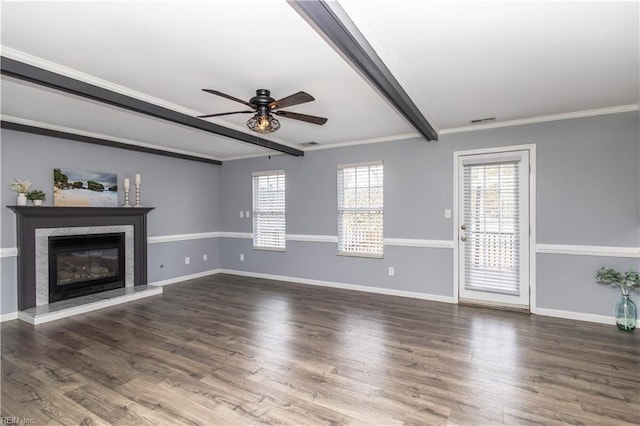 unfurnished living room with a fireplace, wood finished floors, visible vents, baseboards, and beamed ceiling