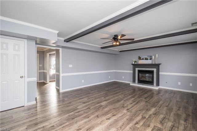 unfurnished living room featuring ornamental molding, a glass covered fireplace, baseboards, and wood finished floors