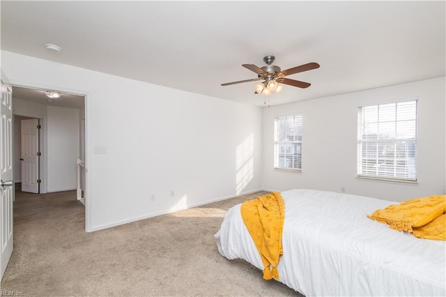 bedroom featuring carpet, baseboards, and ceiling fan