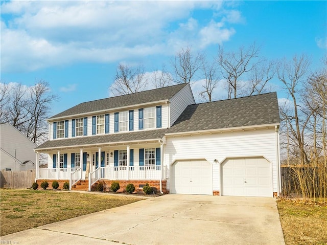 colonial home featuring a garage, driveway, crawl space, a porch, and a front yard