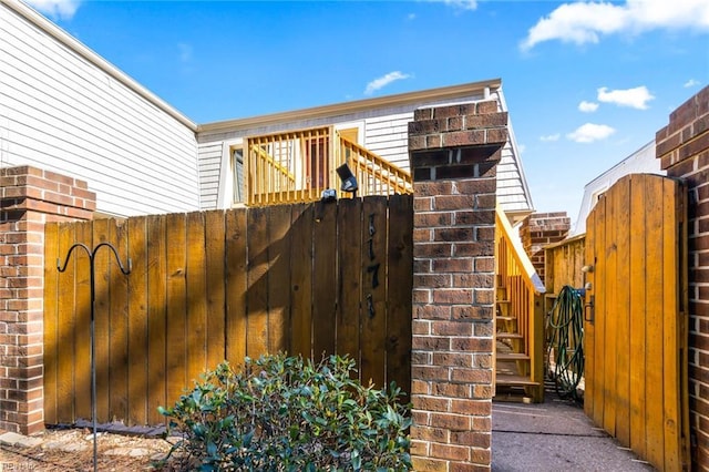 view of gate with fence