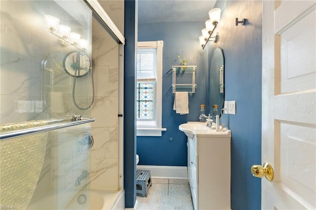 full bathroom with toilet, tile patterned flooring, vanity, and baseboards