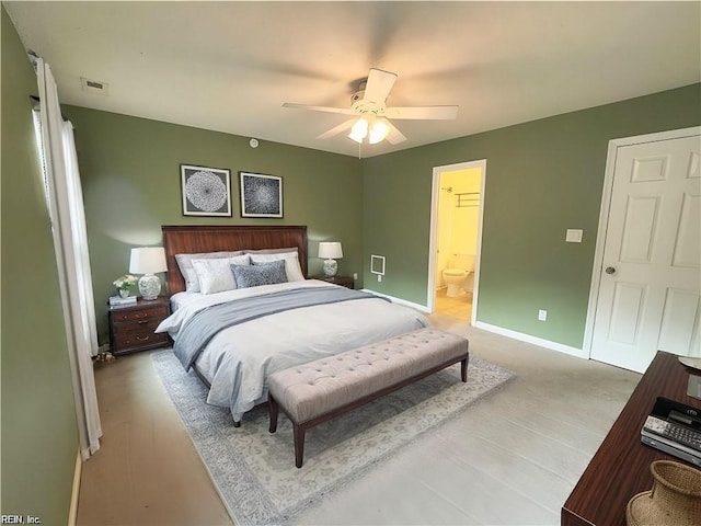 bedroom with connected bathroom, visible vents, ceiling fan, and baseboards