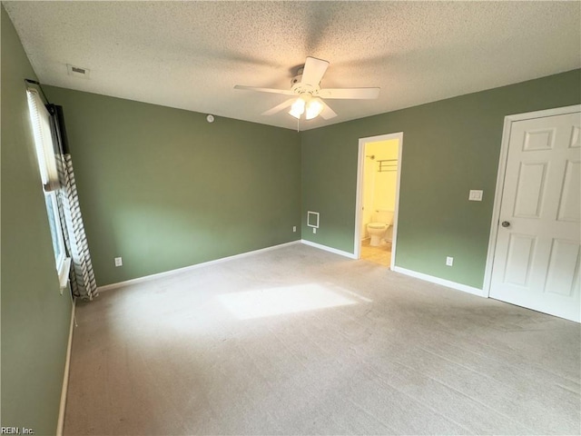 unfurnished bedroom with light carpet, visible vents, and baseboards