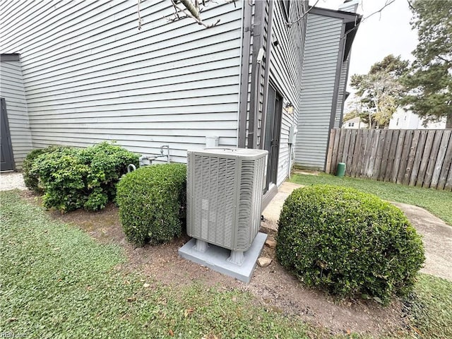 exterior details with fence and central AC unit