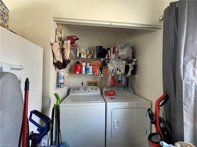 washroom with laundry area and washer and dryer