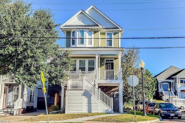 view of front of house featuring a porch and stairway