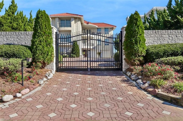 view of gate with fence